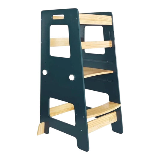 Navy blue Montessori toddler learning tower with safety rails and adjustable platform