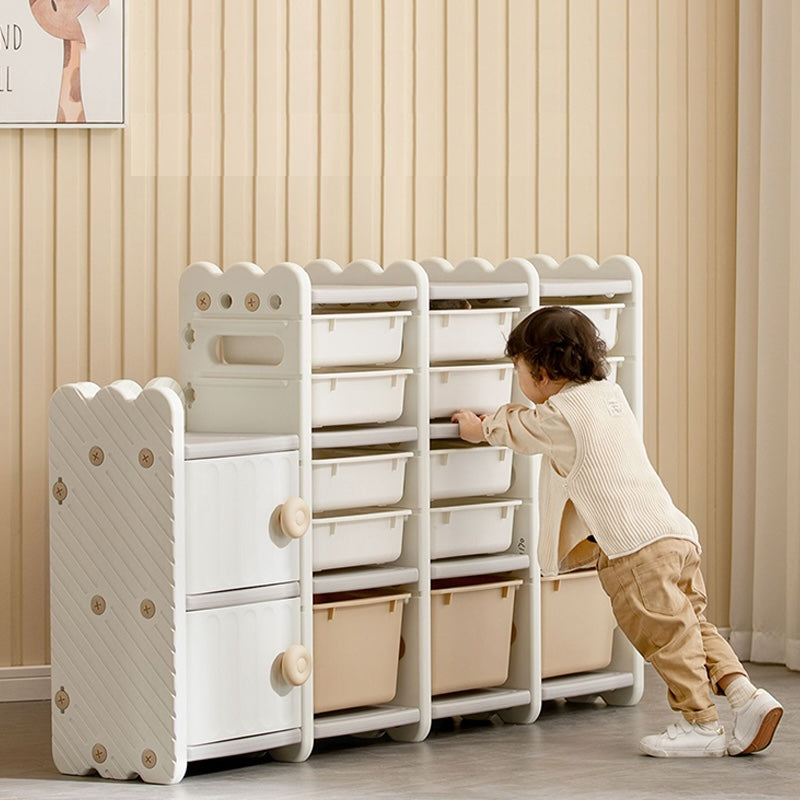 Child playing with white storage unit with drawers and bins for toys NZ
